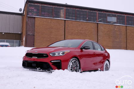 A Kia Forte playing in the snow